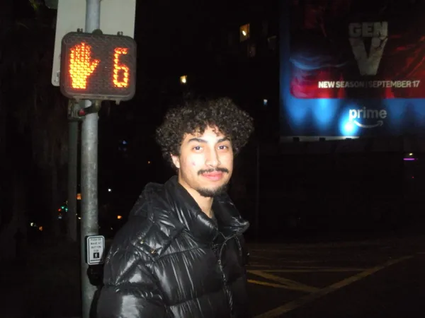 Ethan Exner beside a crosswalk at night