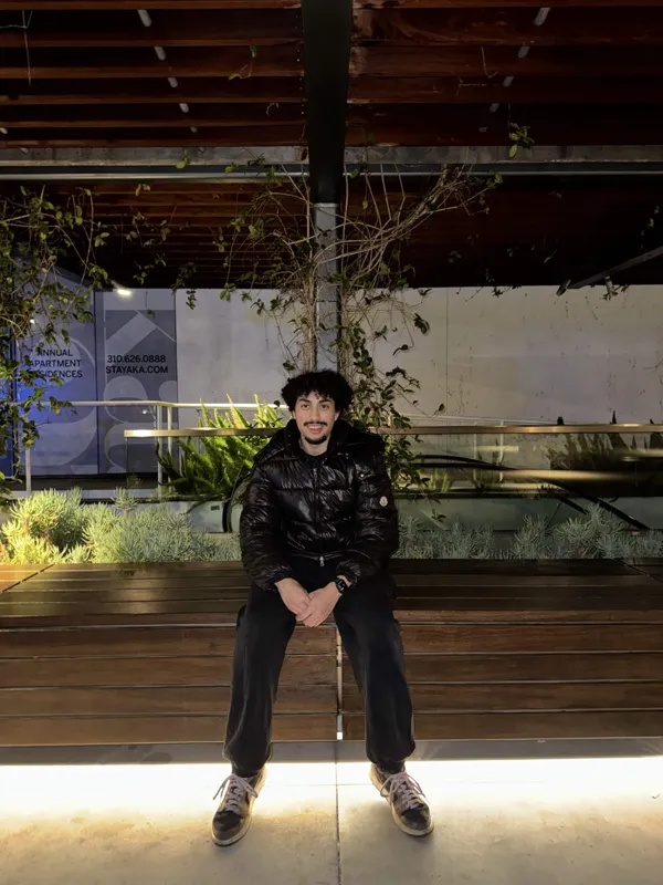 Smiling on the illuminated wooden bench